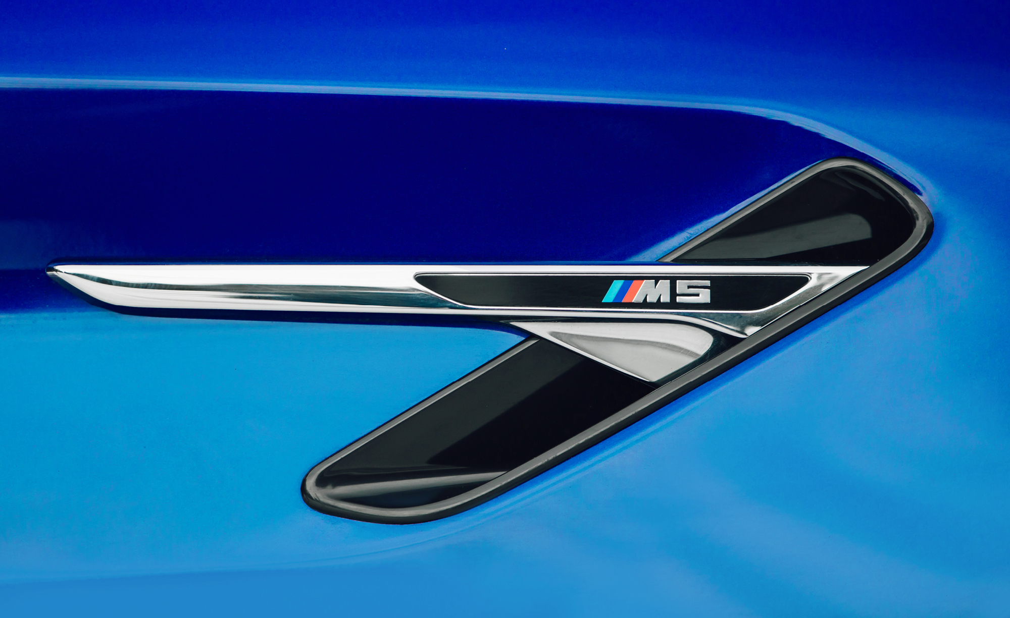 Sleek detailing features the BMW M5 badge