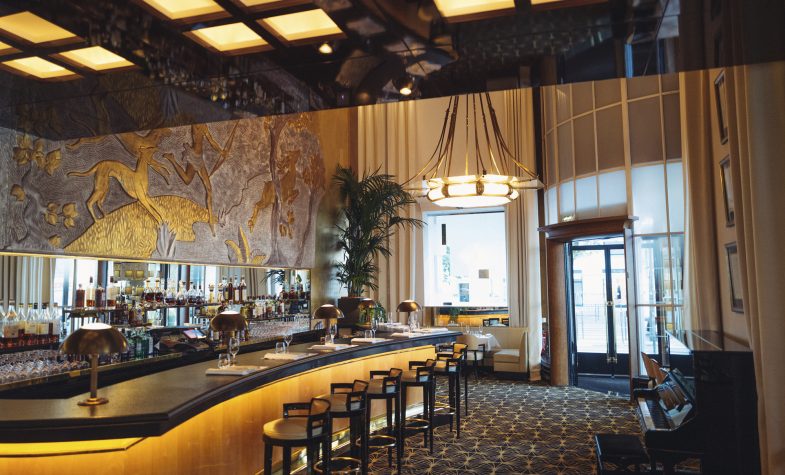 The grand Art Deco dining room at Le Relais Plaza at the Hôtel Plaza Athénée