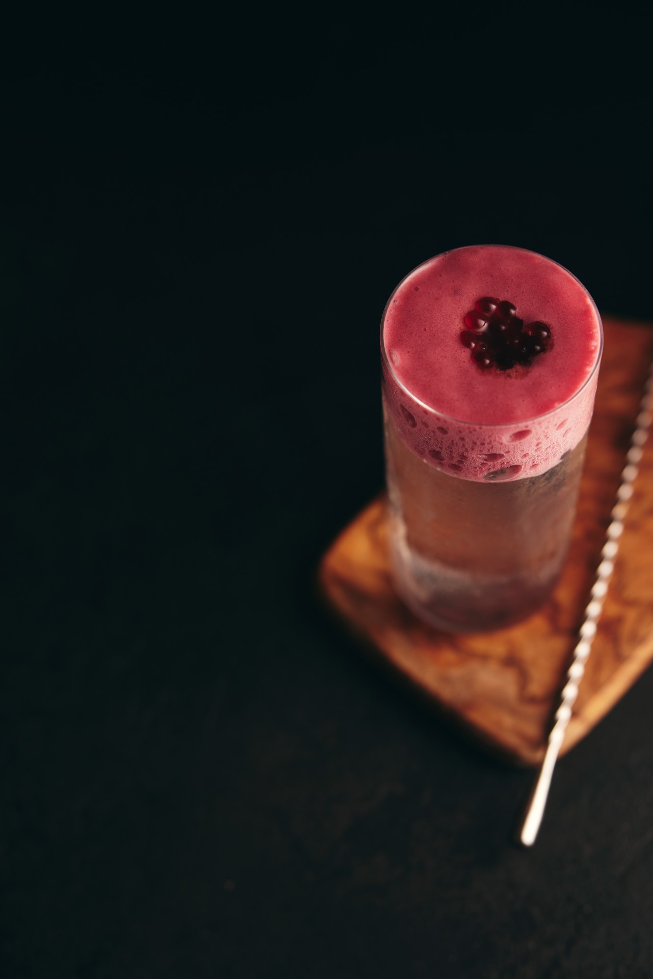 The thrilling Glass 'Oh' Water features a red wine foam and clear whisky and citrus base