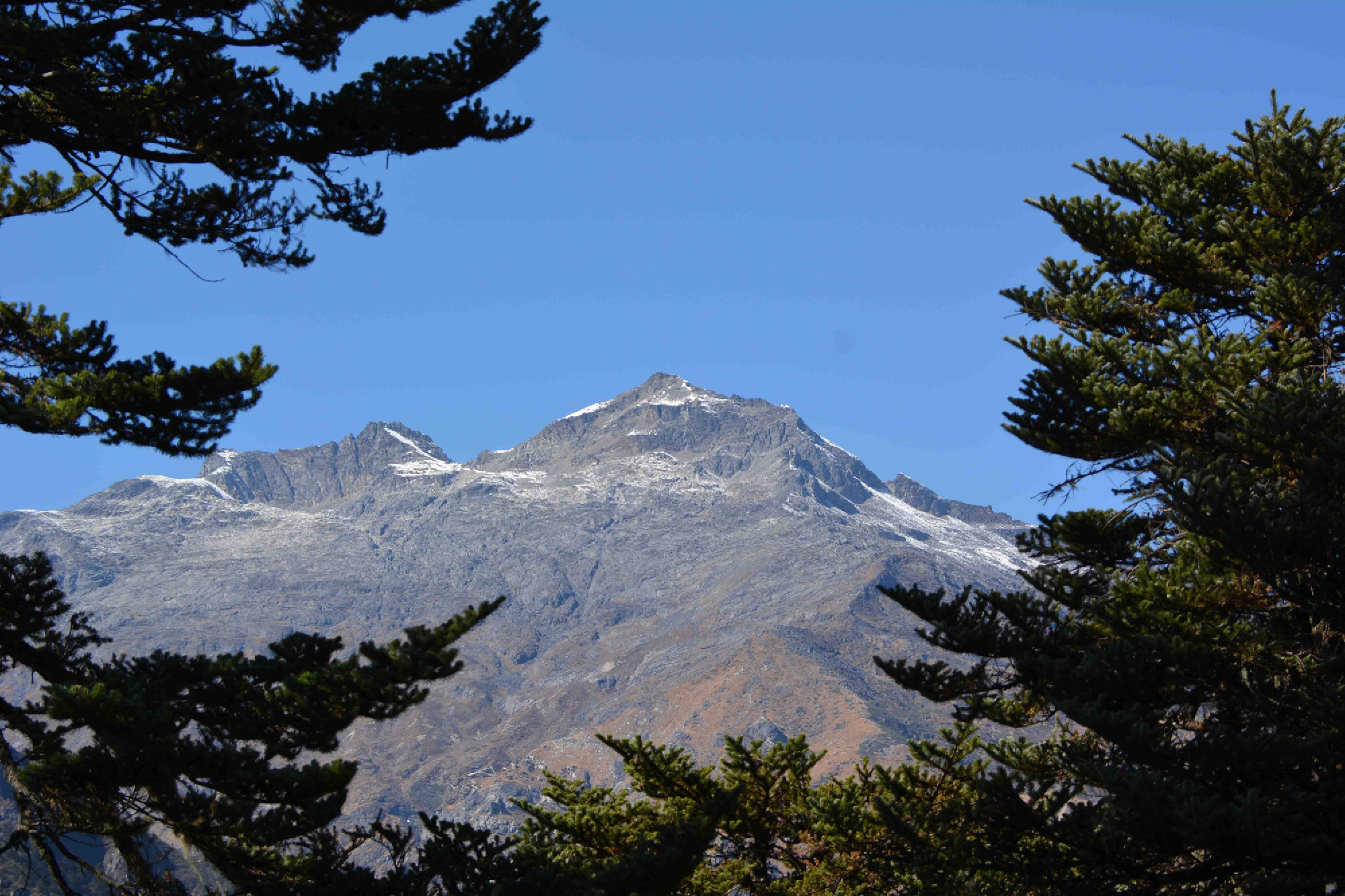 At 7500m, Gangkhar Puensum is the highest mountain in the world no one has summited, owing to the respect of Mahayana Buddhists for the deities they believe inhabit it. Indeed, Bhutan is a deeply spiritual country and the gin in question divine