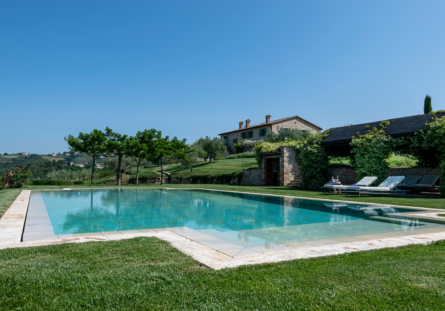 Outdoor pool and garden at Casa Collina, Umbria, Italy