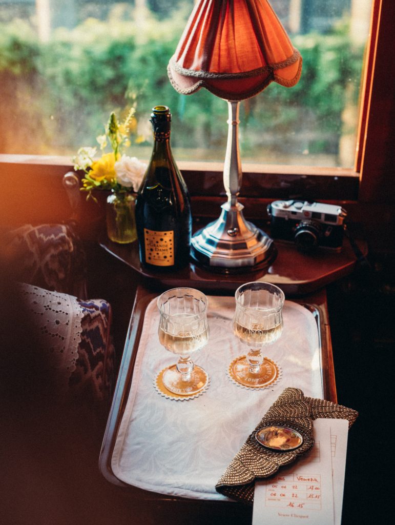 Glasses of Veuve Clicquot enjoyed in train carriage