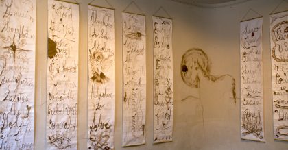 Josephine Foster transmuted the words from her poetry and riddles into these long scrolls with brown ink