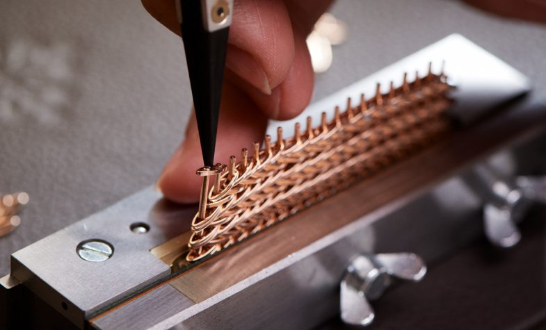 The Golden Ellipse’s rose-gold bracelet's individual links being set by hand