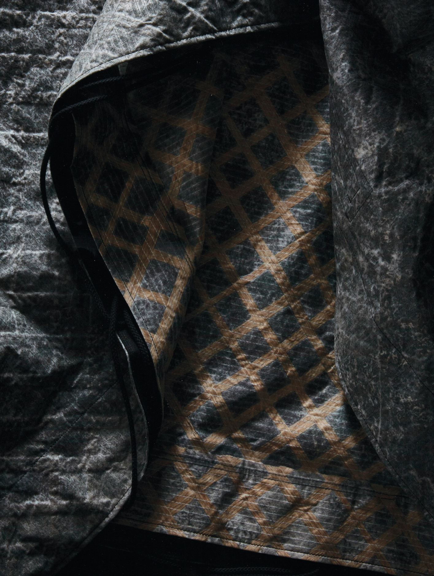 The lattice-patterned cape, £1,100, from Stone Island’s Prototype Research Series 08