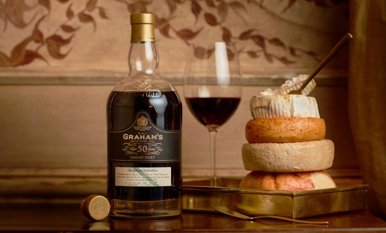 A glass and bottle of Graham's 50 Year Old Tawny Port