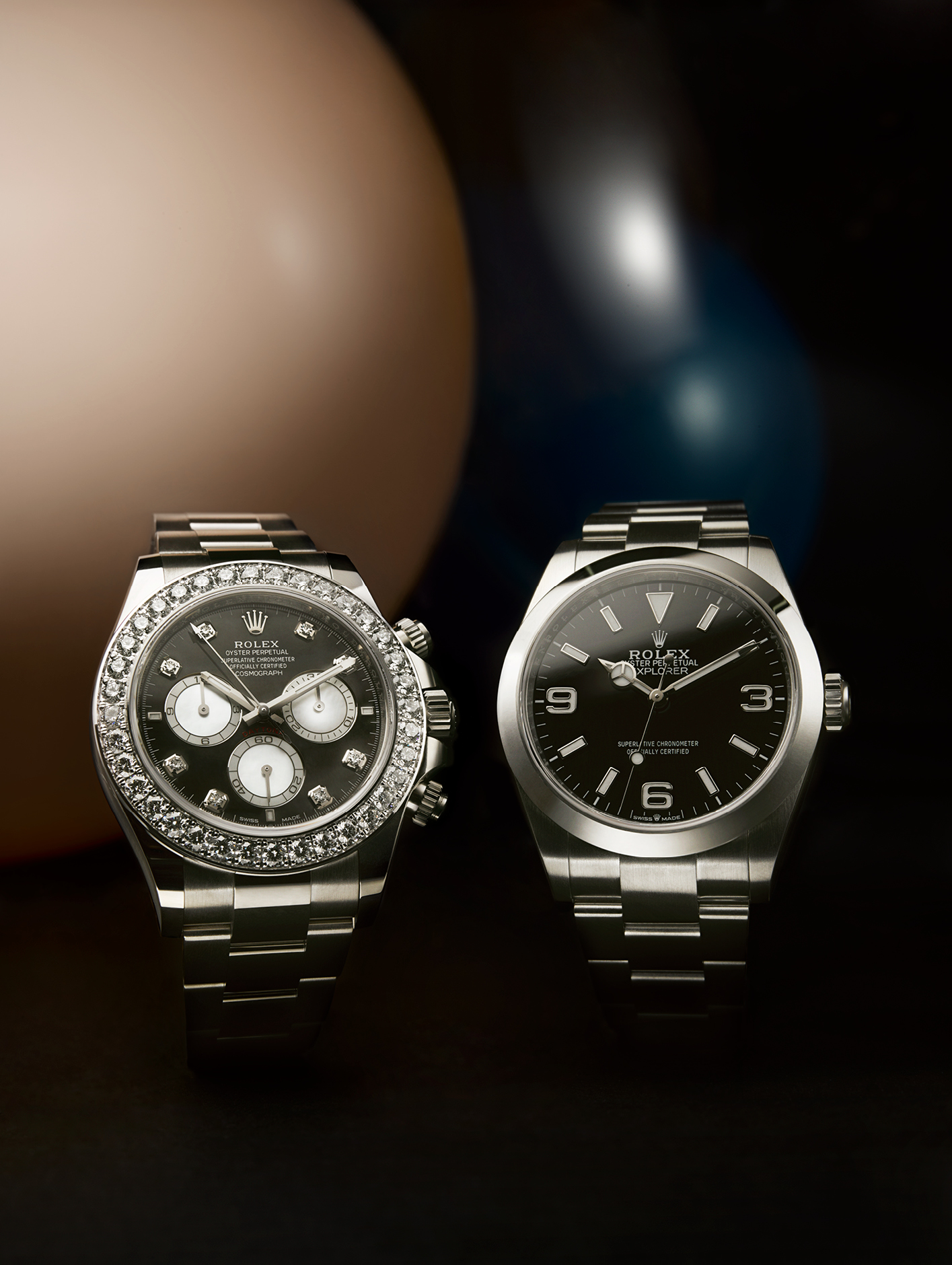 Daytona Cosmograph (left) in 18k white gold, with diamond-set bezel and mother-of-pearl dial, £63,850. And Explorer 40 in Oystersteel with black dial and Chromalight display, £6,650